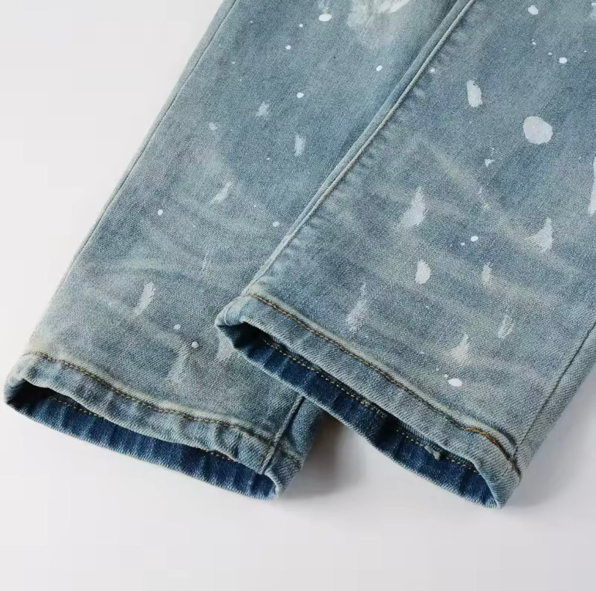 Distressed Slim-Fit Jeans – Light Wash with Paint Splatter Detail